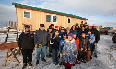 Residents of Hooper Bay, Alaska, celebrate newly-constructed buildings after fire claimed most of the village.