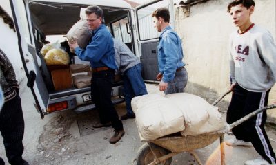 Franklin Graham unloads relief supplies to be distributed among Kosovo refugees.