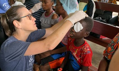 A Samaritan’s Purse nurse removes bandages from the eyes of a young boy after he received cataract surgery at ELWA hospital in Monrovia, Liberia, the summer of 2023.