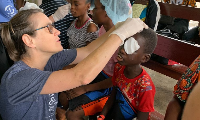 A Samaritan's Purse nurse removes bandages from the eyes of a young boy after he received cataract surgery at ELWA hospital in Monrovia, Liberia, the summer of 2023.